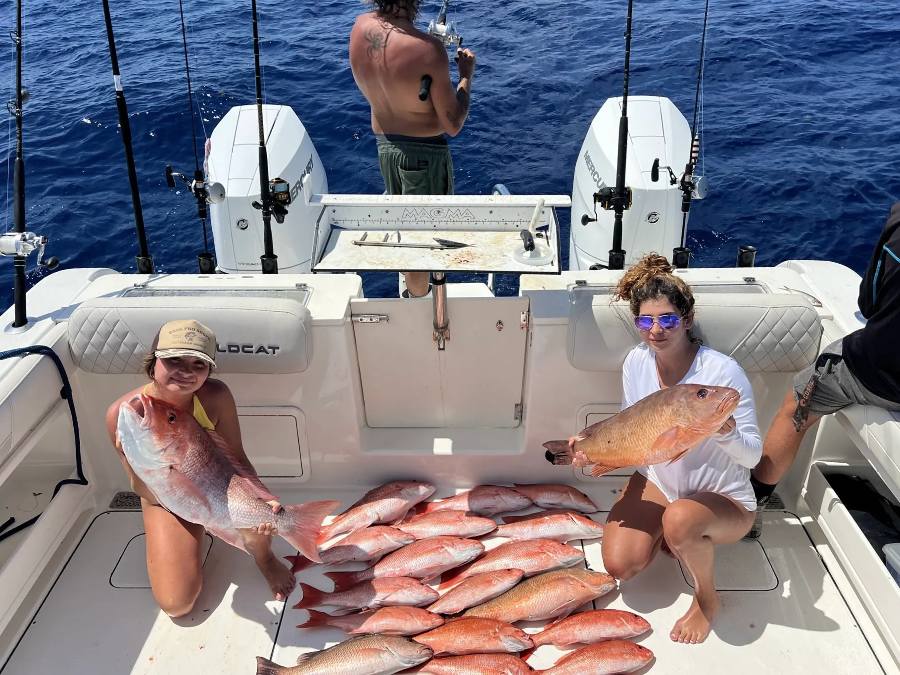 Charter group with a haul of red snapper on the bow of Phat Kat in the Gulf of Mexico